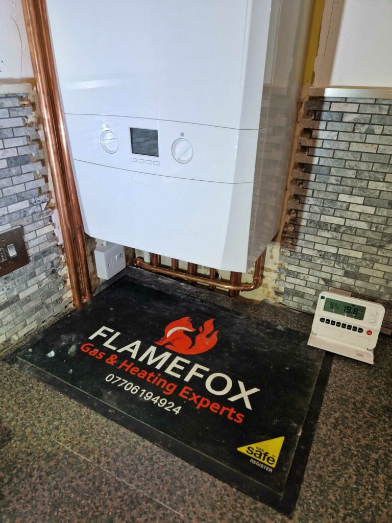 Flamefox Gas and Heating Experts branded safety mat used during property visits