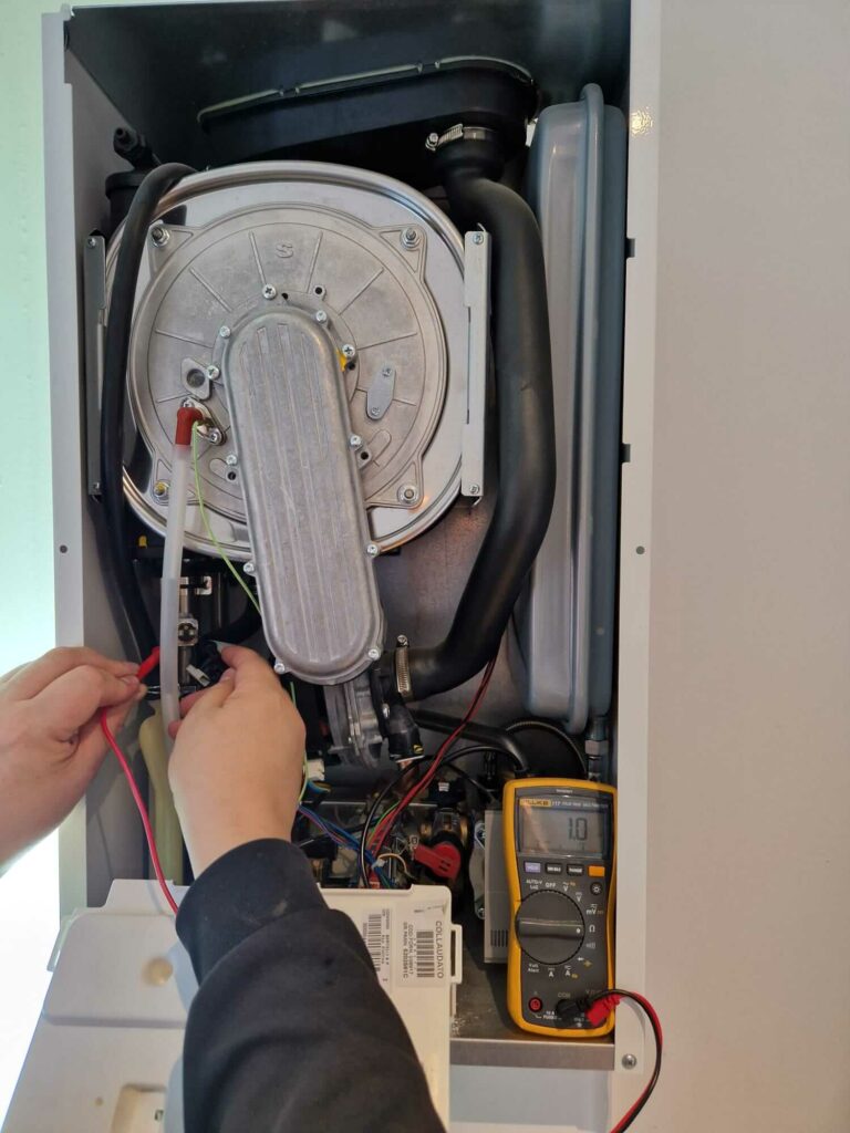 Gas Safe registered engineer performing a boiler service and safety check in Glasgow