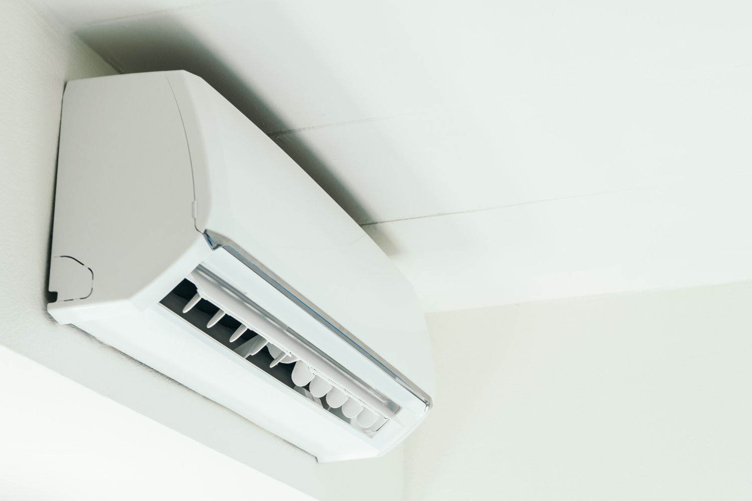 Wall-mounted air-to-air heat pump heating a room in a Glasgow home